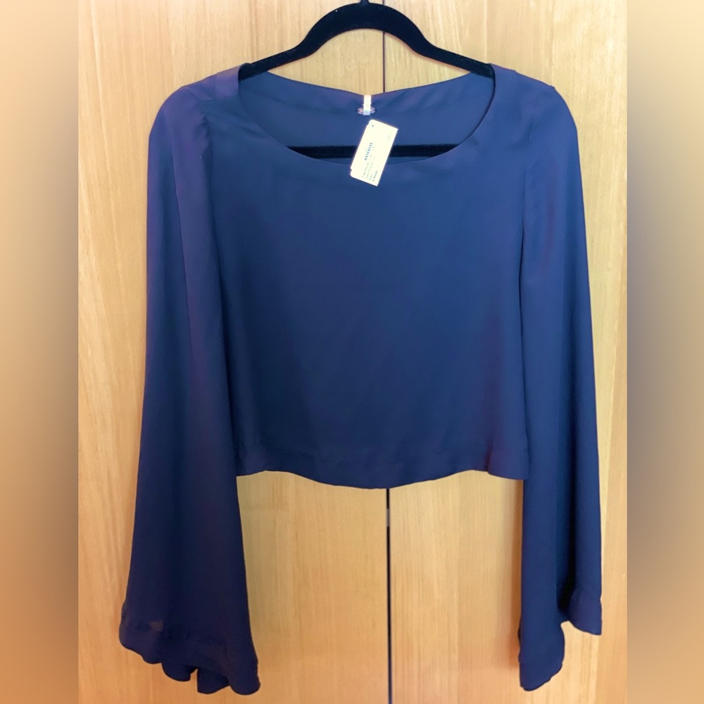 Free people cropped black top with bell sleeves. Size XS